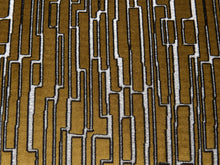 Load image into Gallery viewer, Image 16 of 16: A close-up of a woven textile with an abstract geometric pattern in mustard brown, white, and black.
