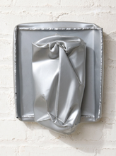 Load image into Gallery viewer, Image 1 of 13: Vintage abstract wall sculpture featuring a crumpled silver-tone metallic form with deep folds and sculptural creases, mounted on a square silver backing with raised decorative edges.
