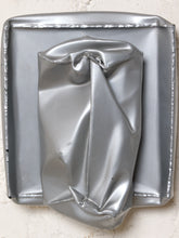Load image into Gallery viewer, Image 2 of 13: Vintage abstract wall sculpture featuring a crumpled silver-tone metallic form with deep folds and sculptural creases, mounted on a square silver backing with raised decorative edges.
