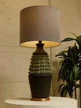 Load image into Gallery viewer, Image 6 of 17: Vintage table lamp with light gray drum shade and textured sage green and charcoal brown sculptural base
