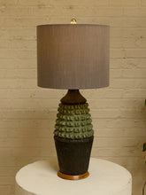 Load image into Gallery viewer, Image 8 of 17: Vintage table lamp with light gray drum shade and textured sage green and charcoal brown sculptural base
