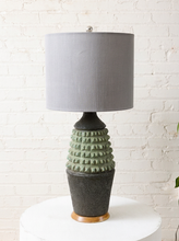 Load image into Gallery viewer, Image 7 of 17: Vintage table lamp with light gray drum shade and textured sage green and charcoal brown sculptural base
