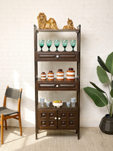 Load image into Gallery viewer, Image 1 of 25: Vintage dark wood étagère bookshelf featuring three open display shelves, two drawers with raised rectangular panel details, a lower double-door cabinet with geometric square panels, and round cream-colored knobs.
