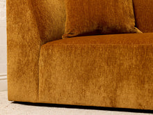 Load image into Gallery viewer, Image 14 of 16: Close-up of a mustard yellow textured fabric sofa with a matching throw pillow, showing the seat cushion, armrest, and upholstery detail.
