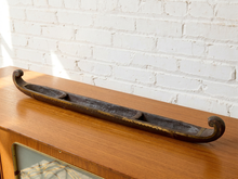 Load image into Gallery viewer, Image 5 of 12: Vintage hand-carved wooden boat sculpture with long narrow shape, open interior, cross supports, and warm aged wood finish
