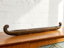Load image into Gallery viewer, Image 1 of 12: Vintage hand-carved wooden boat sculpture with long narrow shape, open interior, cross supports, and warm aged wood finish
