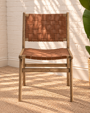 Load image into Gallery viewer, Sylas dining chair with rich mocha basket-weave leather seat and backrest, warm rubberwood frame, and tapered legs
