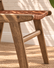 Load image into Gallery viewer, Sylas dining chair with rich mocha basket-weave leather seat and backrest, warm rubberwood frame, and tapered legs

