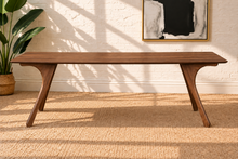 Load image into Gallery viewer, Tanner dining table in Natural Walnut with elongated rectangular top and sculpted splayed legs in a Mid-Century Modern design.
