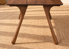 Load image into Gallery viewer, Tanner dining table in Natural Walnut with elongated rectangular top and sculpted splayed legs in a Mid-Century Modern design.
