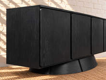 Load image into Gallery viewer, Thera 4-Door Buffet Credenza in Charcoal with sculptural curved base and Art Deco detailing
