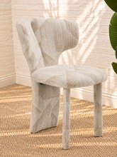 Load image into Gallery viewer, Vada cream beige patterned dining chair with sculptural split back, rounded upholstered seat, and fully upholstered legs.
