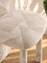 Load image into Gallery viewer, Vada cream beige patterned dining chair with sculptural split back, rounded upholstered seat, and fully upholstered legs.
