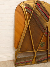 Load image into Gallery viewer, Deconstructed piano harp with gold-tone cast metal frame, exposed strings, tuning pins, red felt, and aged patina

