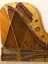 Load image into Gallery viewer, Deconstructed piano harp with gold-tone cast metal frame, exposed strings, tuning pins, red felt, and aged patina

