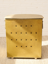 Load image into Gallery viewer, Vintage beige Atomic Age clothes hamper with rounded lid, brass-tone trim, textured patterned finish, and metal starburst accent
