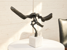 Load image into Gallery viewer, Rivulet abstract bronze sculpture with flowing organic openwork form and dark patina mounted on a square white stone base
