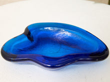 Load image into Gallery viewer, Vintage cobalt blue sculptural art glass ashtray with thick curved edges and organic hand-formed shape.
