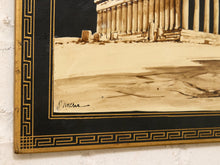 Load image into Gallery viewer, Close-up of a framed artwork showing part of a classical columned building in sepia tones, with a black border and gold Greek key pattern around the edge.
