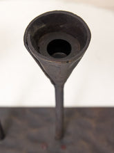 Load image into Gallery viewer, A close-up of a dark metal funnel-shaped component mounted on a vertical rod, photographed against a white background with a dark textured surface at the bottom.
