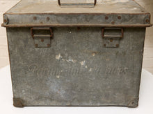 Load image into Gallery viewer, An antique galvanized metal storage chest with a handle, latches, and embossed 'Panamanian Pictures' text on the front, displayed on a white surface.
