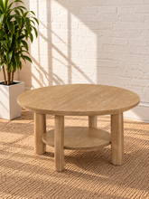 Load image into Gallery viewer, Image 1 of 5: Vito round coffee table in Sunwashed Oak with sculpted legs, circular lower shelf, and natural wood-grain finish
