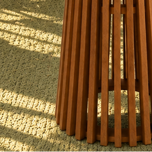 Load image into Gallery viewer, Vivian 31-inch round bar table in warm teak with slatted tabletop and tall sculptural vertical slat pedestal base
