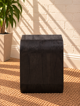 Load image into Gallery viewer, Walter side table in Midnight Cafe Mindi wood with a rounded rectangular top, curved arch-style sides, and visible natural wood grain.
