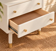 Load image into Gallery viewer, Image 4 of 4: Yvette 2-drawer side table in Chalk White with polished gold details and elevated legs
