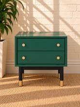 Load image into Gallery viewer, Image 1 of 5: Yvette 2-drawer side table in Juniper Green with polished gold details and elevated black and gold legs
