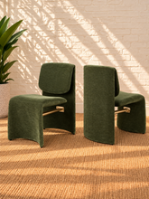 Load image into Gallery viewer, Zain sculptural frame dining chair in Moss Olive polyester fabric with brushed brass stretcher bar
