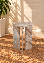 Load image into Gallery viewer, Zanea marble side table in Cocoa Vein with round brown marble top and sculptural three-panel base

