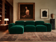 Load image into Gallery viewer, Emerald green velvet sectional with chaise in a curated living room with antique portrait and walnut shelving.
