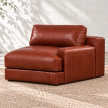 Load image into Gallery viewer, Image 3 of 5: Simulated Montara right-arm chair in Brighton Hero brown leather, showing the lower padded armrest and taller rear section against a white brick wall.
