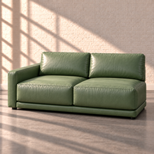 Load image into Gallery viewer, Image 17 of 18: Simulated Orinda individual 75-inch left-arm two-seat sofa section in sage green Sequoia Rainforest leather, without accent pillows, in the Sunbeam white brick setting.
