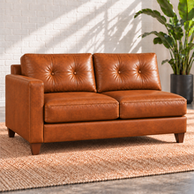 Load image into Gallery viewer, Image 11 of 13: Solano 67-inch left-arm condo sofa in distressed Sequoia Fawn leather with two seats, styled with a plain rug and tropical plant.
