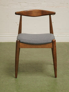 Dark wood single chair with gray seat