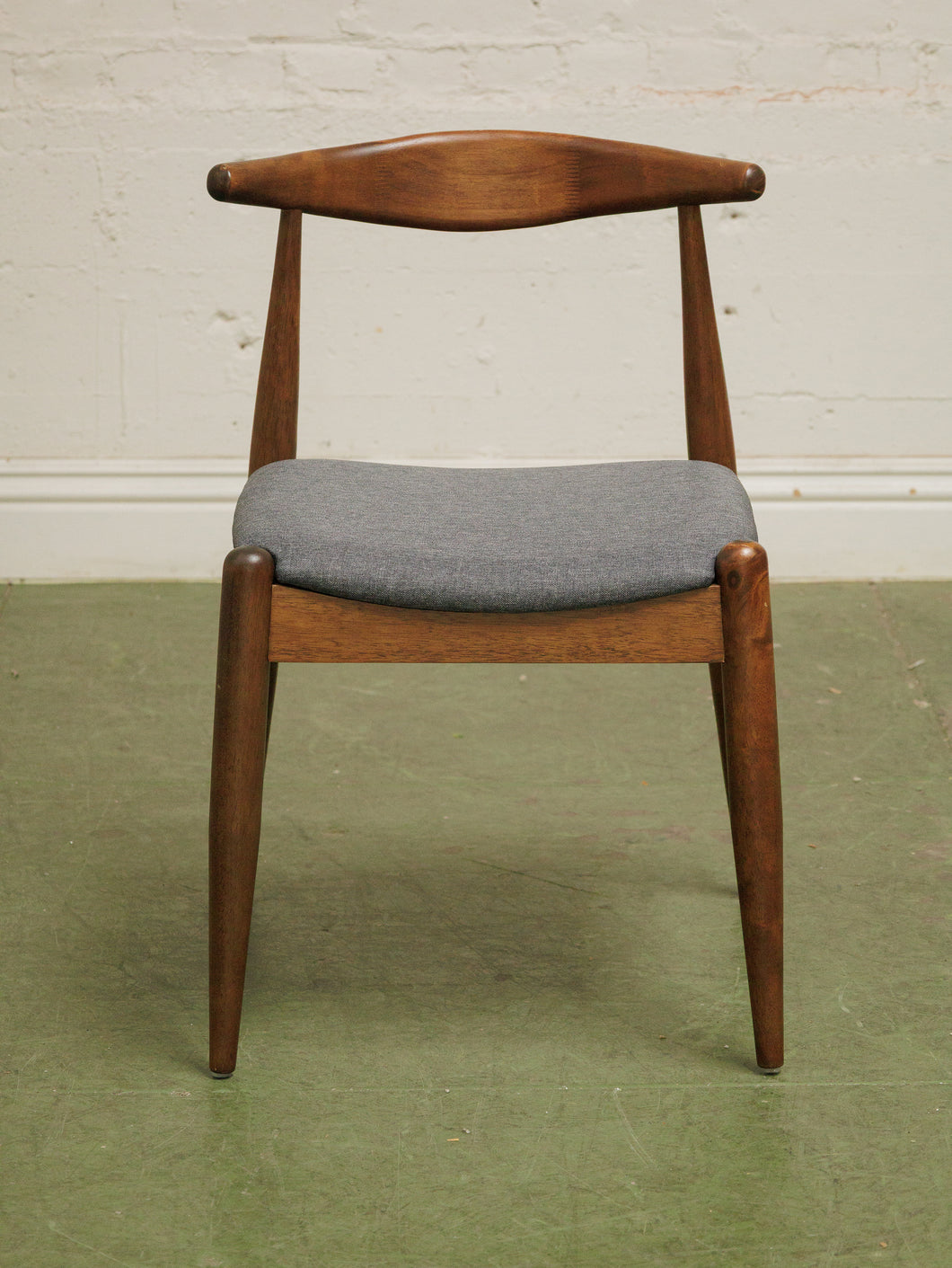 Dark wood single chair with gray seat