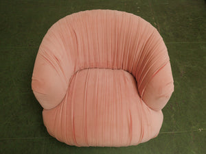 Pink pleated club chair