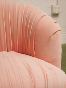 Pink pleated club chair