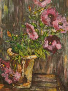 Painting of flowers in a vase, framed in an ornate gold frame