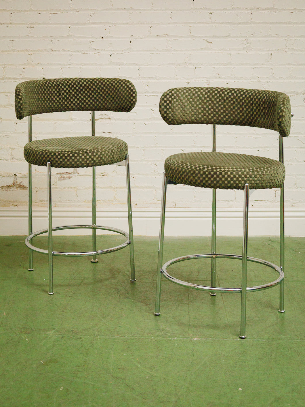 Pair of green checker counter stools in chrome