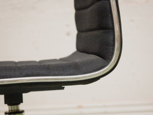 Armless Ribbed Swivel Office Chair in Black Upholstery