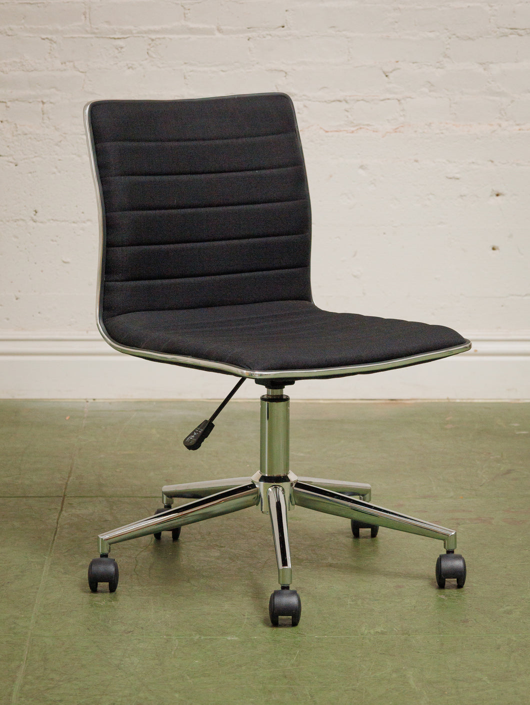 Armless Ribbed Swivel Office Chair in Black Upholstery