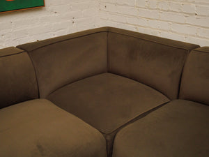 Dark green three-piece modular sectional corner sofa