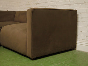 Dark green three-piece modular sectional corner sofa