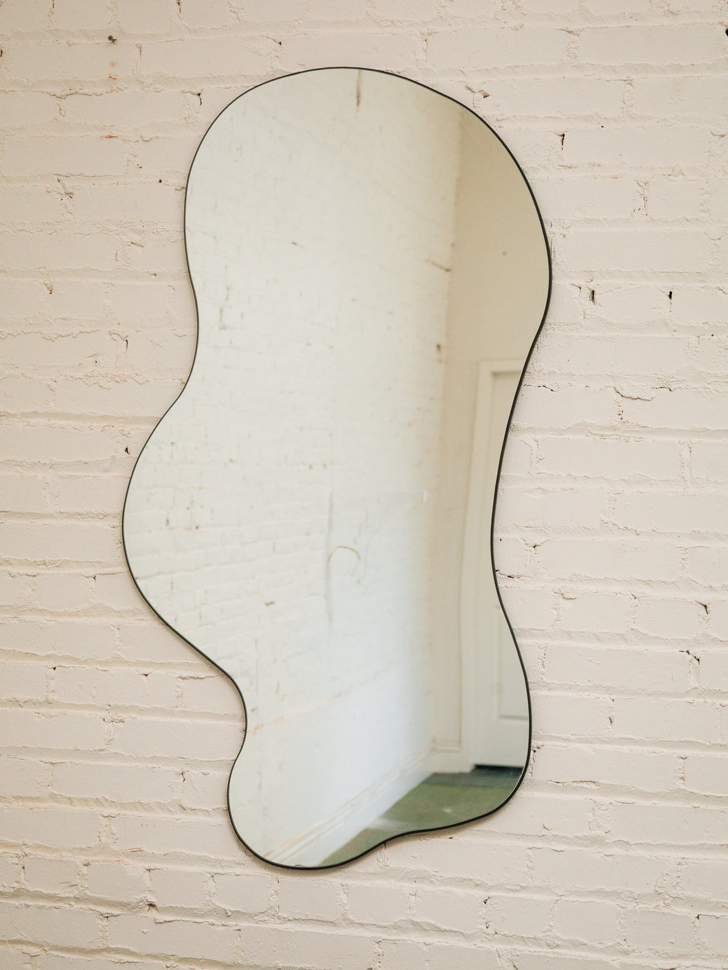 Huge Amoebic black shape mirror sleek black frame